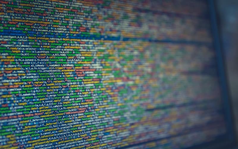 A detailed view of colorful source code displayed on a computer screen, representing modern programming and technology.