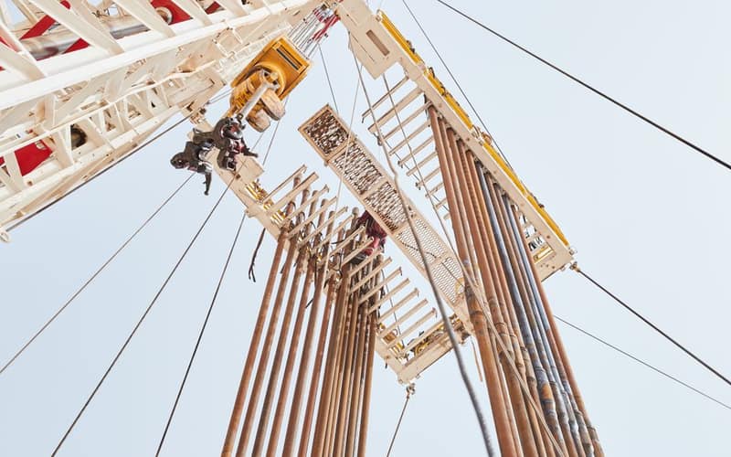 Dynamic low angle view of an oil rig structure in Al Wafrah, Kuwait.