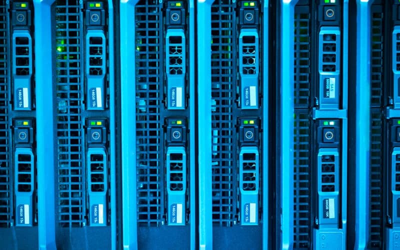 Detailed image of illuminated server racks showcasing modern technology infrastructure.
