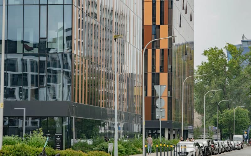 Contemporary office architecture with glass reflections in Wrocław, Poland.