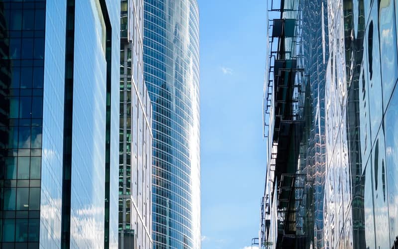 Contemporary skyscrapers reflecting the sky, showcasing modern architectural design.