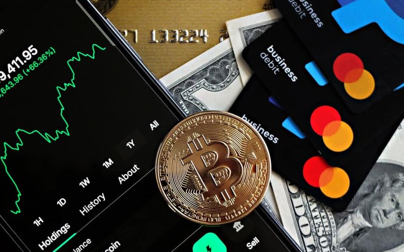 A dynamic image showcasing Bitcoin, credit cards, and financial apps for investment enthusiasts.