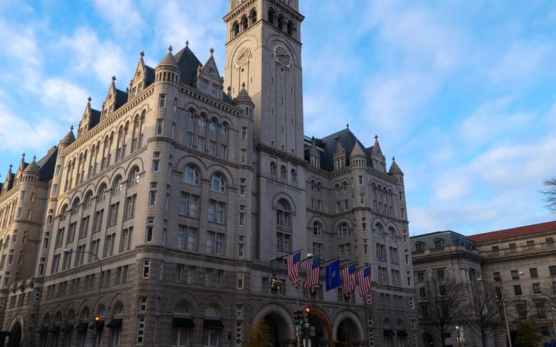 The Old Post Office Building in Washington DC under a clear blue sky.