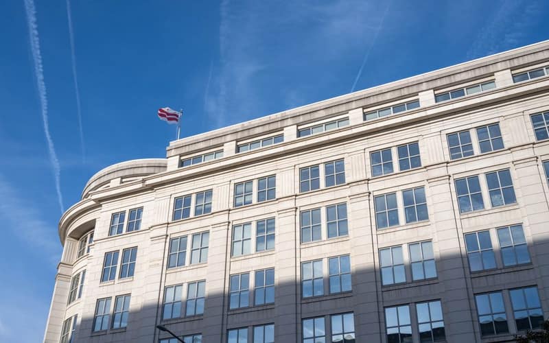 Elegant office building under a clear blue sky in Washington, D.C.