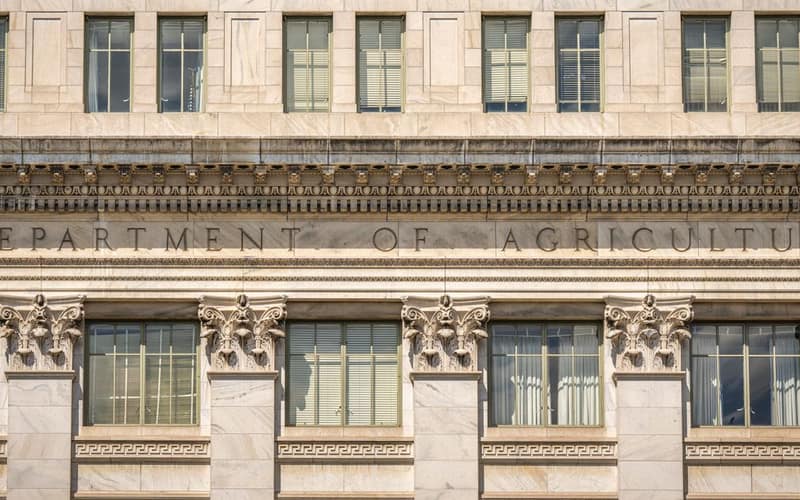 Close-up of the Department of Agriculture building's architectural facade, showcasing intricate columns and windows.