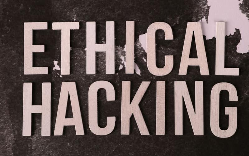 Creative composition with 'Ethical Hacking' text on textured background for cybersecurity theme.