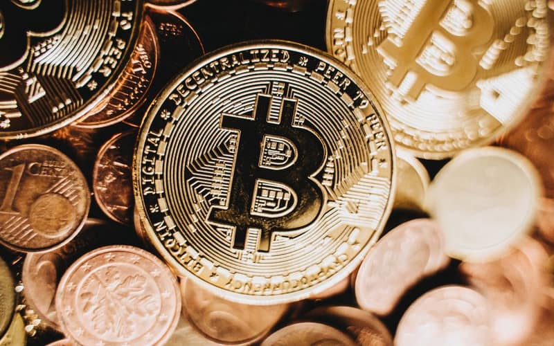 Detailed close-up of bitcoin and euro coins representing cryptocurrency and traditional money in Erfurt.