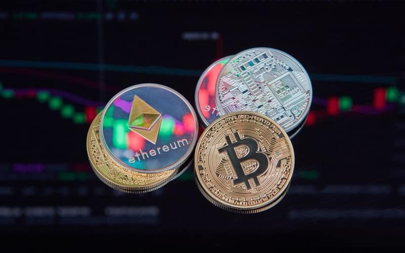 Floating Bitcoin and Ethereum coins with a market trend chart in the background symbolizing digital finance.
