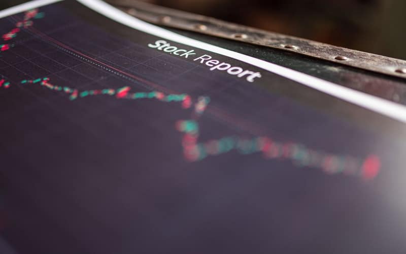 Detailed stock report showing market trends on paper charts.