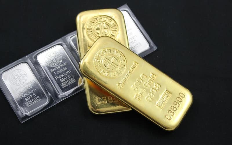 Close-up of gold and platinum bars depicting wealth and investment potential.